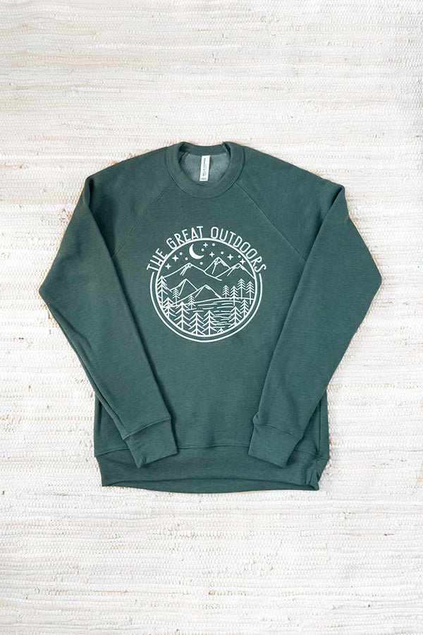 flat lay of The Great Outdoors raglan sleeve Bella and Canvas sponge fleece sweatshirt in forest green on a white textured background