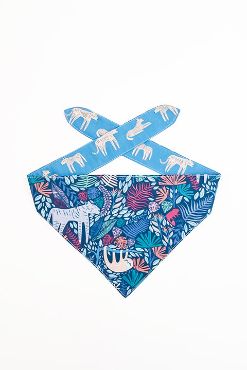 jungle animals print side of jungle friends reversible pet bandana. prints feature jungle animals, plants and tigers on blue backgrounds.