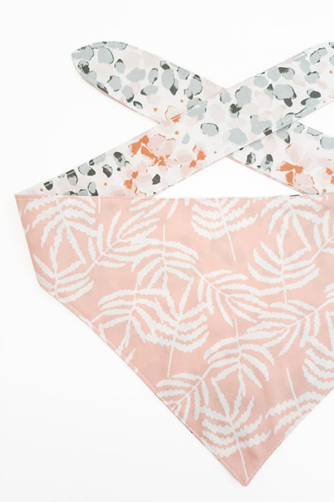 pastel ferns print detailed view of watercolor ferns reversible pet bandana. prints feature pastel shades of pink and green.