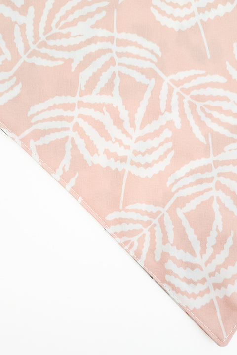 pastel ferns zoomed in detail of watercolor ferns reversible pet bandana. prints feature pastel shades of pink and off white