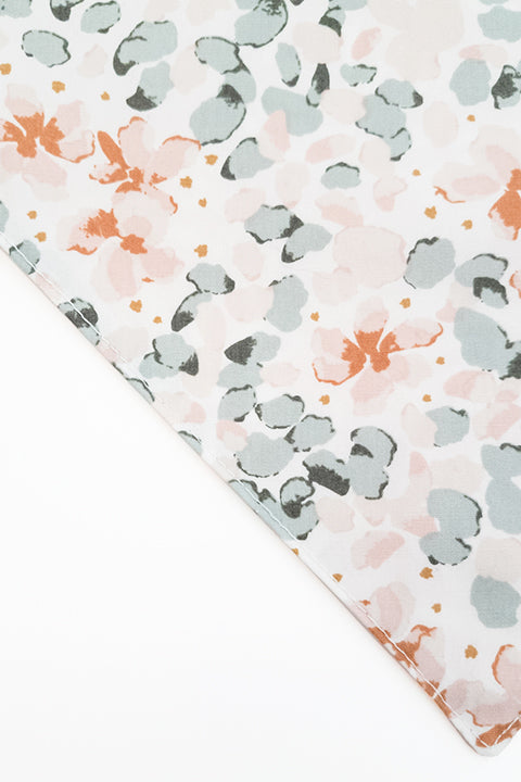 watercolor floral zoomed in detail of watercolor ferns reversible pet bandana. prints feature pastel shades of pink and green.