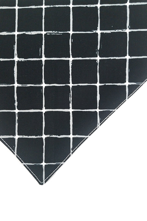 zoomed in image of the black and white grid print front of the bandana