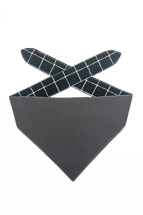 100% premium cotton reversible pet bandana shown made from a charcoal grey reverse and black and white grid front
