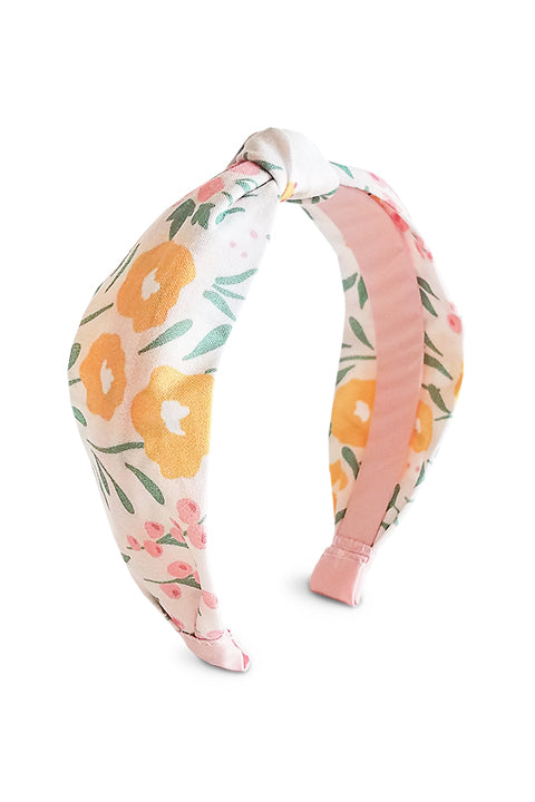 image of an upcycled handmade headband sustainably made from a 100% cotton fabric scraps in a happy floral print with cream, mustard yellow, green and pink