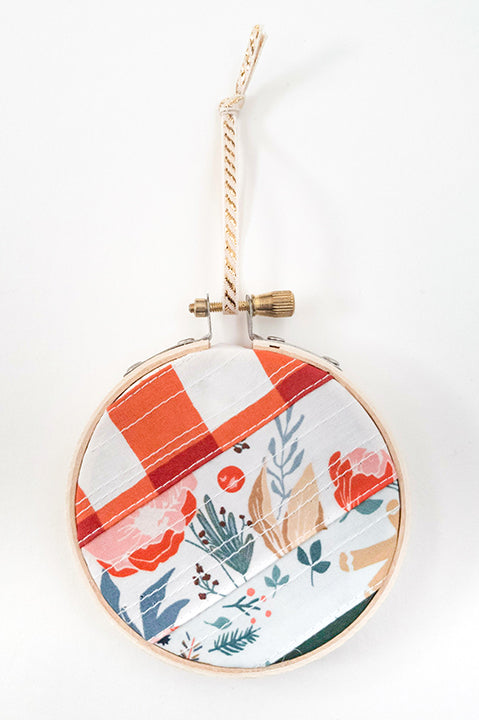 3 inch diameter wooden embroidery hoop ornament crafted from quilted scrap fabric in holiday and christmas prints - diagonal stripes 2