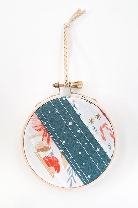 3 inch diameter wooden embroidery hoop ornament crafted from quilted scrap fabric in holiday and christmas prints - diagonal stripes 4