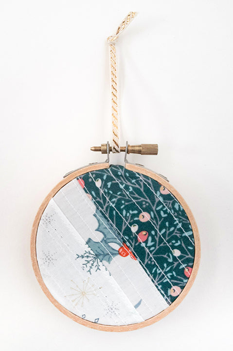 3 inch diameter wooden embroidery hoop ornament crafted from quilted scrap fabric in holiday and christmas prints - diagonal stripes 5