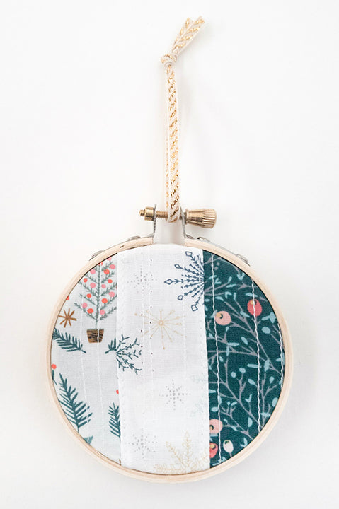 3 inch diameter wooden embroidery hoop ornament crafted from quilted scrap fabric in holiday and christmas prints - vertical stripes 1