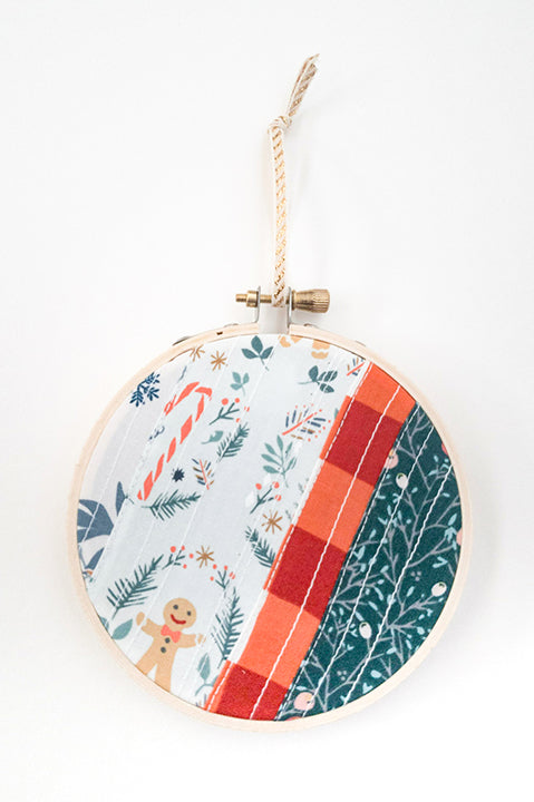 4 inch diameter wooden embroidery hoop ornament crafted from quilted scrap fabric in holiday and christmas prints - diagonal stripes 3
