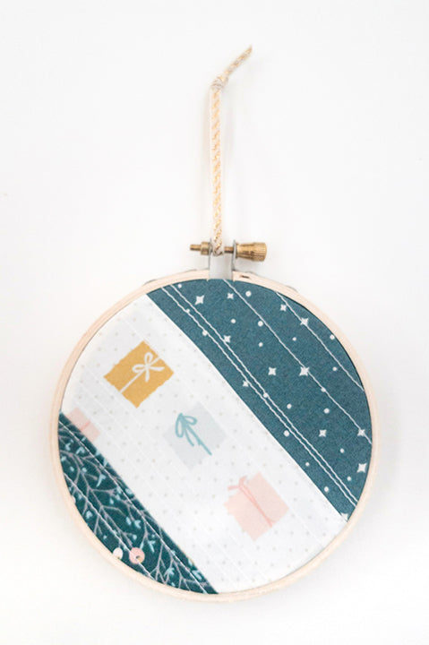 4 inch diameter wooden embroidery hoop ornament crafted from quilted scrap fabric in holiday and christmas prints - diagonal stripes 6