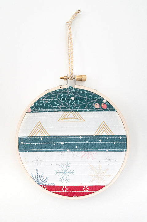 4 inch diameter wooden embroidery hoop ornament crafted from quilted scrap fabric in holiday and christmas prints - horizontal stripes 3