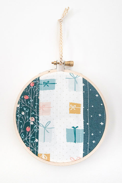 4 inch diameter wooden embroidery hoop ornament crafted from quilted scrap fabric in holiday and christmas prints - vertical stripes 3