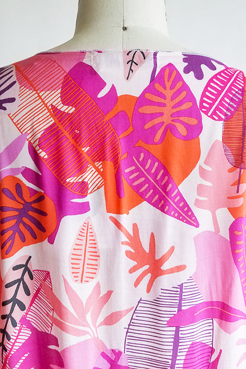 back neck detail view of small batch open front fashion kimono made from a 100% rayon hot pink tropical leaf print fabric shown on a dress form
