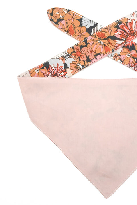 detailed view of a 100% premium cotton reversible 2 in 1 pet bandana made in a blush pink solid fabric for the reverse and the rustic blooms floral print for the front